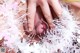 A close up of a woman's mouth covered in tinsel.