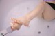 A close up of a person's feet in a bathtub.