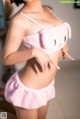 A woman in a pink bunny costume posing for a picture.