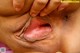 A close up of a man's mouth with his hands on his mouth.