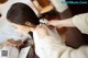 A woman in a white dress is getting ready for her wedding.