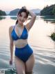 A woman in a blue bikini standing in the water.