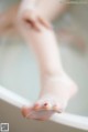 A close up of a person's feet in a bathtub.