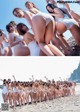 A group of women in white bathing suits posing for a picture.