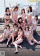 A group of women in bikinis posing for a magazine cover.